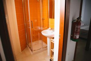 a bathroom with a shower and a sink at LA CASITA DE BAUTISTA 2 llaves montanchez -caceres in Montánchez