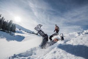 a person is laying in the snow at Hotel Säntis Lodge in Unterwasser