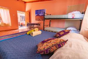 Cama ou camas em um quarto em Hostal Nuevo Sol y Viento