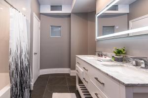 a bathroom with a shower and a sink at Family Friendly 3-bedroom beauty in Le Plateau by DenStays in Montréal
