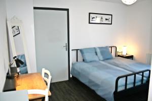 Llit o llits en una habitació de BonAbri Vacances - Chambres d'hôtes