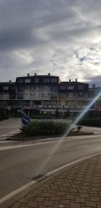 a blurry picture of a street with a building at Apartman Hana in Sanski most