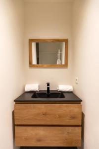 Kylpyhuone majoituspaikassa GUILLEMINS STATION FLATS