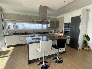 A kitchen or kitchenette at Eslanzarote Eco Villa Tony, heated pool, jacuzzi, Sat tv, Super wifi