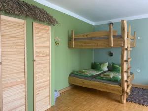 a room with two bunk beds and a closet at Pension Cubana in Rothenburg