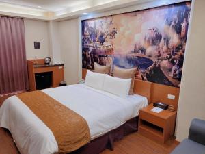 Postel nebo postele na pokoji v ubytování Golden Sands Motel
