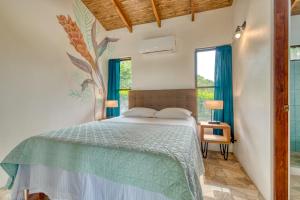 Postel nebo postele na pokoji v ubytování Hotel Villas Tangerine