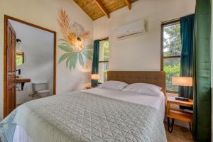 Postel nebo postele na pokoji v ubytování Hotel Villas Tangerine