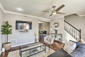 a living room with a couch and a ceiling fan at Chic Townhome with Deck 6 Mi to Dtwn Baltimore in Baltimore