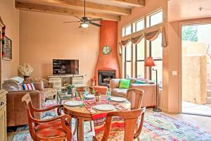 a living room with a table and chairs at Adobe Escape with Outdoor Kitchen and Pool Access in Tubac