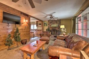 a living room with a leather couch and a table at Wildlife Lodge Columbia Retreat off I-70! in Columbia