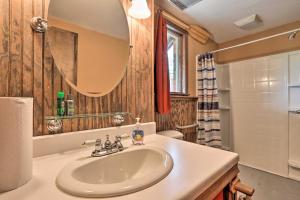 a bathroom with a sink and a mirror at Wildlife Lodge Columbia Retreat off I-70! in Columbia +28 photos