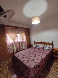 Кровать или кровати в номере Las Cabañas De Hugo