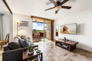 a living room with a couch and a table at Kailua Village#307 in Kailua-Kona