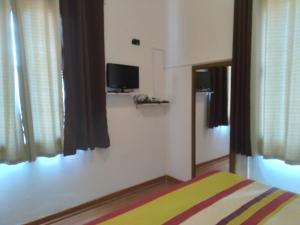 Μια τηλεόραση ή/και κέντρο ψυχαγωγίας στο Apartamento da Maria Eunice