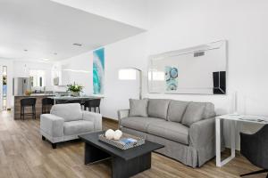 a living room with a couch and a table at Zenza Boutique Hotel in Providenciales