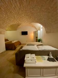 Cama o camas de una habitación en Dimora Le Volte Ostuni