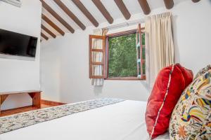 Postel nebo postele na pokoji v ubytování Hacienda San Miguel Yucatan
