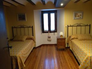 En eller flere senger på et rom på Casa Rural El Granero