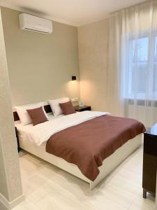 Ένα ή περισσότερα κρεβάτια σε δωμάτιο στο Apart City Home