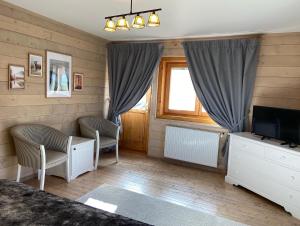 Postel nebo postele na pokoji v ubytování Carpathian Log Home