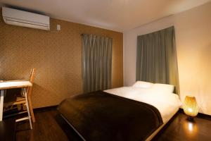 מיטה או מיטות בחדר ב-Apartment Sun Bright - Vacation STAY 89260v