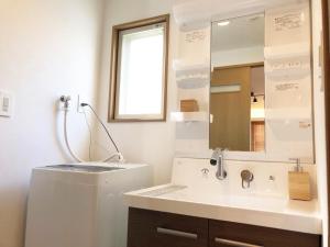 a bathroom with a sink and a mirror at Chill Inn Honan - Vacation STAY 94561v in Tokyo