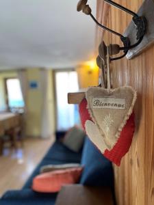 a heart shaped object is hanging on a wall at Jack's Nest in Campertogno