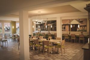 a dining room with tables and chairs at Thöles*** Hotel in Vilsen in Bruchhausen-Vilsen