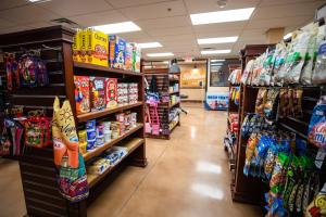 a store aisle filled with lots of different types of snacks at Holiday Inn Club Vacations at Desert Club Resort, an IHG Hotel in Las Vegas