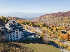 an aerial view of a building on a hill at Vidik Residence in Kopaonik +86 photos