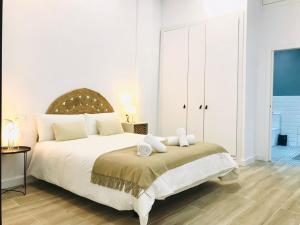 Posteľ alebo postele v izbe v ubytovaní Munilla & Beach by ELE Apartments