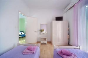 Posteľ alebo postele v izbe v ubytovaní Penelope - LOGGOS APARTMENTS