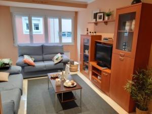 TV a/nebo společenská místnost v ubytování Apartamento Puerto de Foz