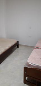 Postel nebo postele na pokoji v ubytování Apartamentos con estacionamiento cerca al parque