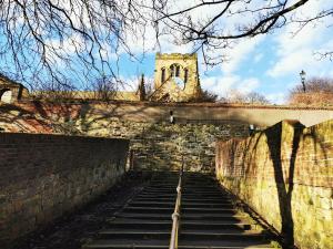 a stairway leading up to a building with a tower at The Thoresby - Room Only in Scarborough