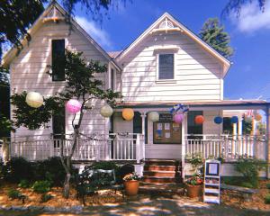 a white house with decorations on the front of it at Santa Cruz Hostel in Santa Cruz