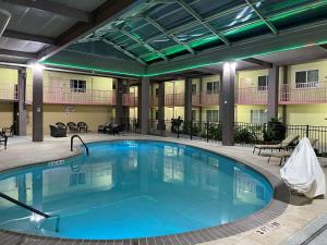 The swimming pool at or close to SureStay Plus Hotel by Best Western Odessa