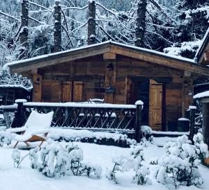 a log cabin with snow on the ground at Charmant Mazot in Saint-Gervais-les-Bains