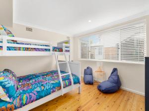 a bedroom with a bunk bed and blue bean bags at Thurlow Avenue 49 Unit 1 in Nelson Bay