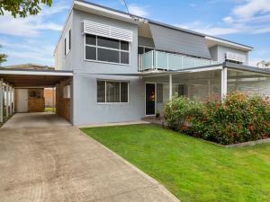 a large white house with a driveway at Thurlow Avenue 49 Unit 1 in Nelson Bay