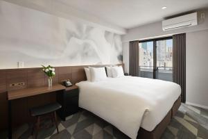 Katil atau katil-katil dalam bilik di Oakwood Hotel & Apartments Azabu Tokyo