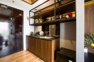 a kitchen with a sink and a counter at Futura Studio-Modern Apartment near CBD BSD in Serpong