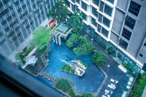 an aerial view of a park in a city at 188 Suites KLCC by CoBNB in Kuala Lumpur