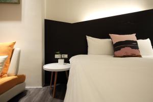 Postel nebo postele na pokoji v ubytování Hai Sheng Wei B&B