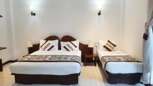 Postel nebo postele na pokoji v ubytování Royal Kandyan Hotel + 37 fotografií