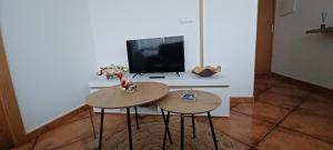 Televízia a/alebo spoločenská miestnosť v ubytovaní Loft Turístico