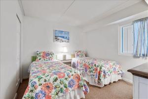 Postel nebo postele na pokoji v ubytování Sea Watch Condos III + 12 fotografií