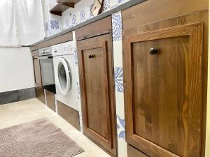 a laundry room with a washer and dryer at CESARE'S HOME in Catania