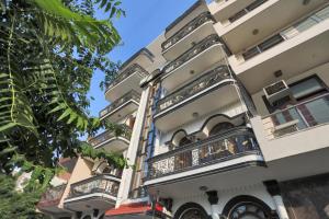 a building with balconies on the side of it at HOTEL OM PLAZA in New Delhi